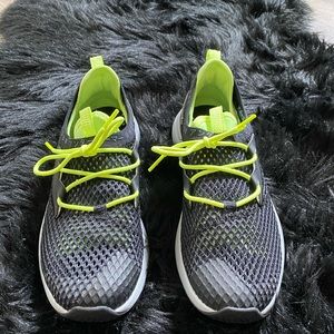 Under Armour woman’s shoes 9.5 black and lime green.